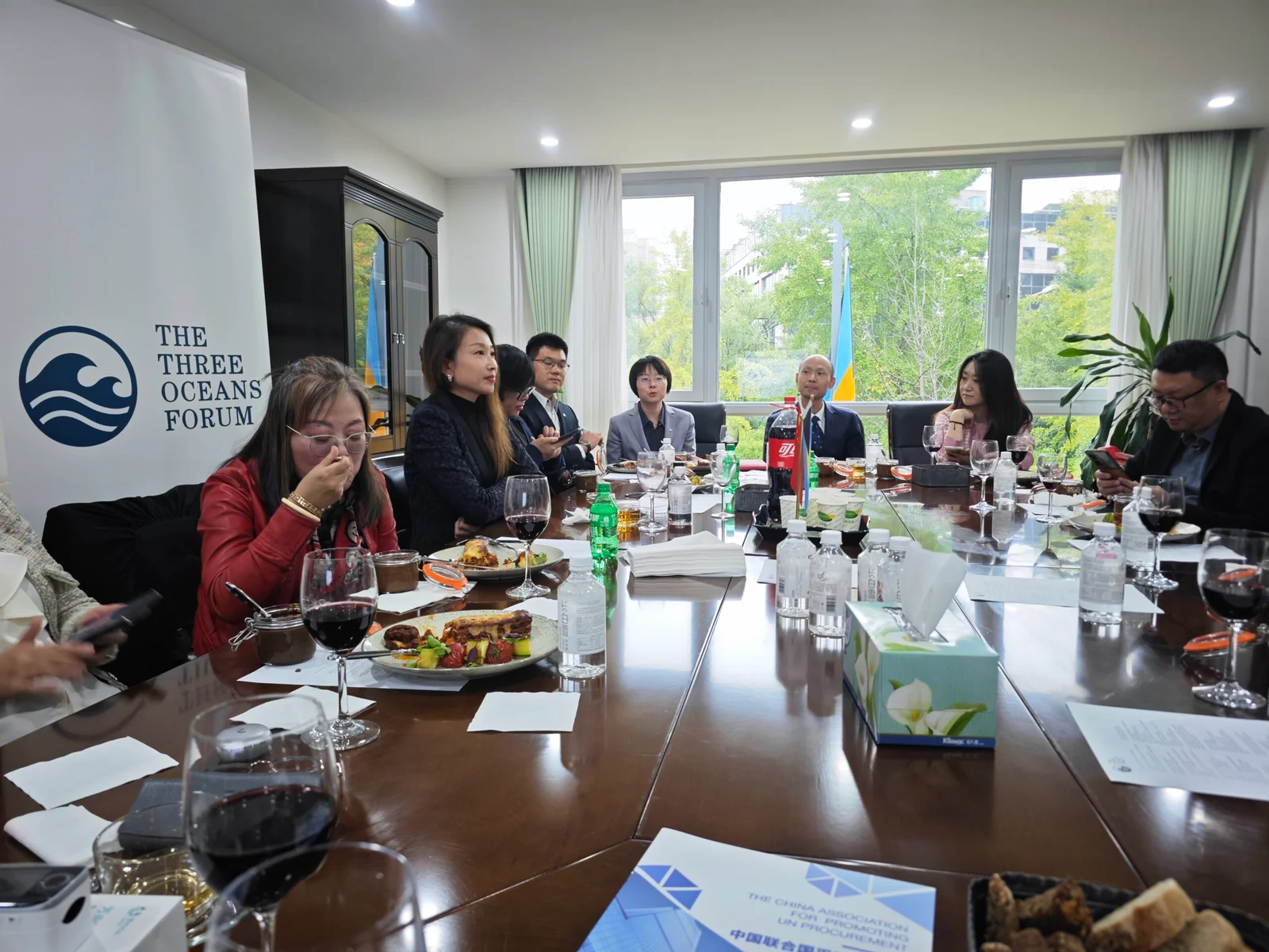 Partners gathered around a working lunch